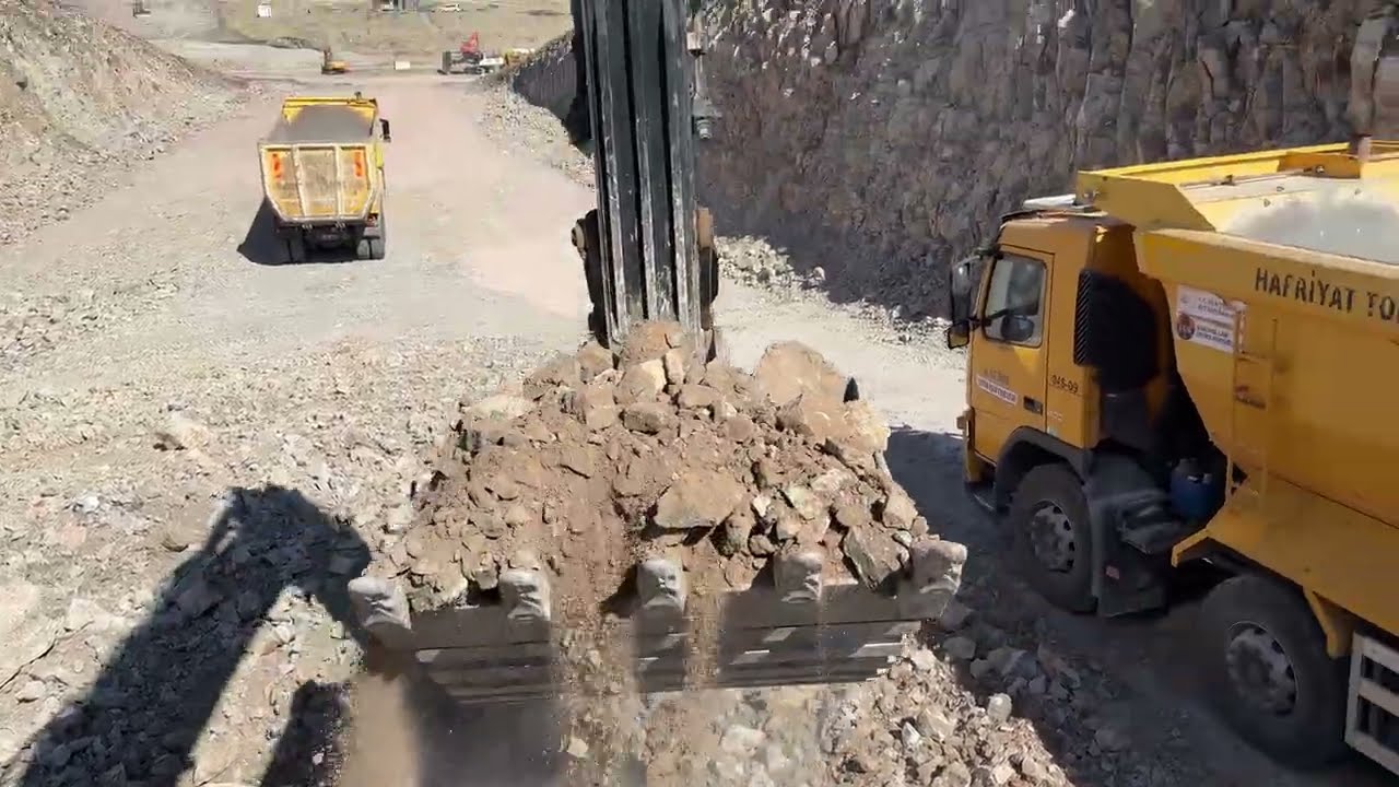 Excavator I load stony material onto trucks.