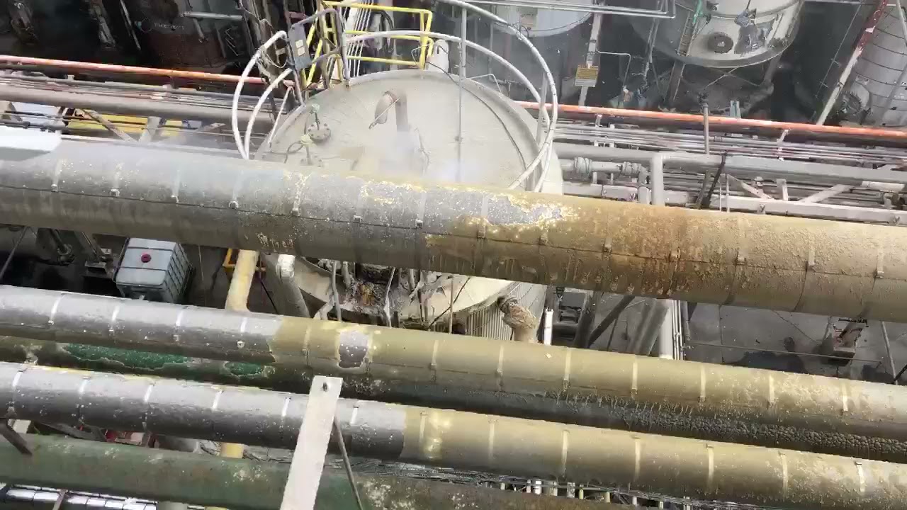Dry Ice Blasting - Removing resin from insulated pipes at a chemical plant- JW & Associates Blasting
