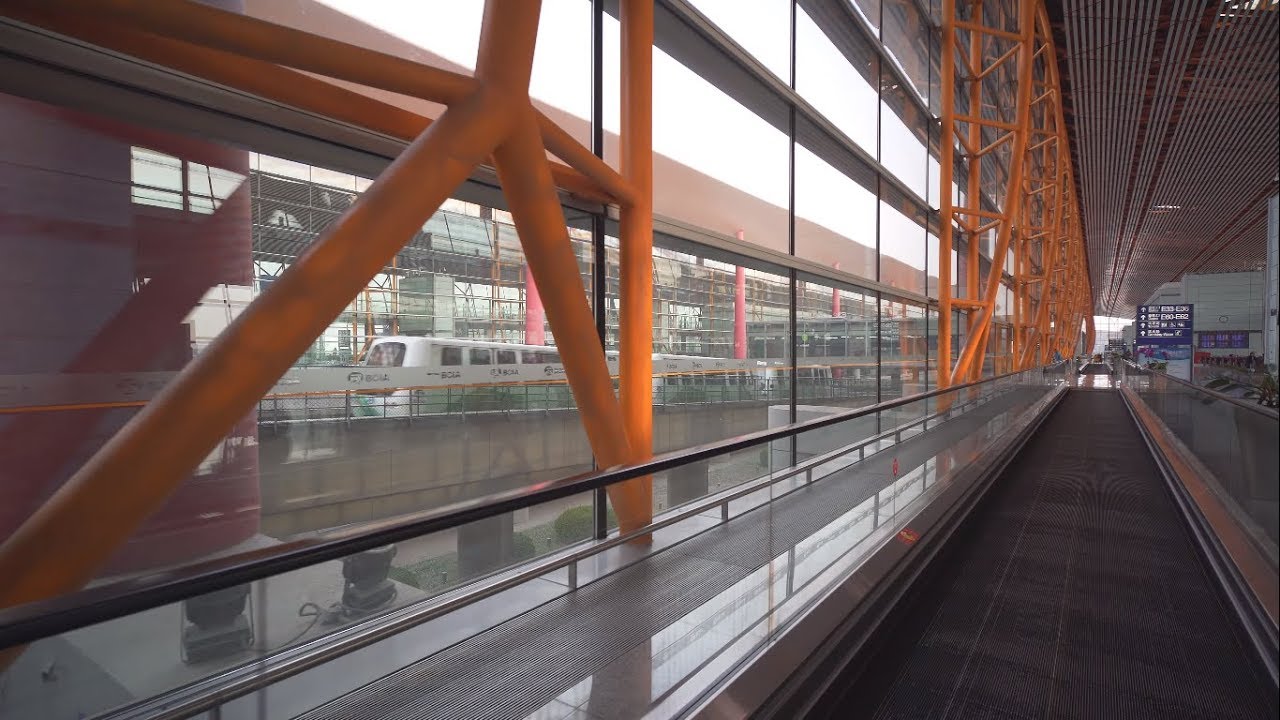 China, Beijing Capital International Airport, waking to gate E32, 1X moving sidewalk