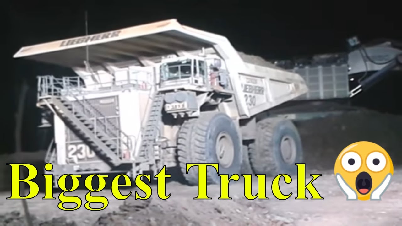 Liebherr truck T282B and excavator liebherr 9800 at night day