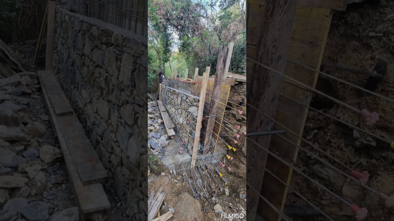 La costruzione del #muro in pietra in cemento armato rivestito di pietre recuperate dal vecchio muro