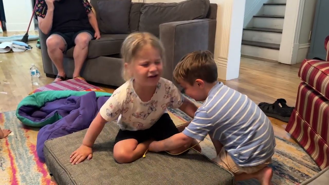 Louise wrestles Charlie ￼