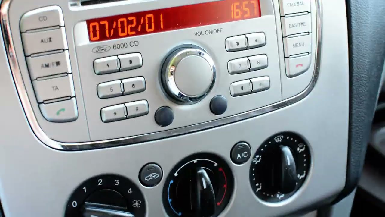 Where do I connect AUX cable in Ford Focus 2004?
