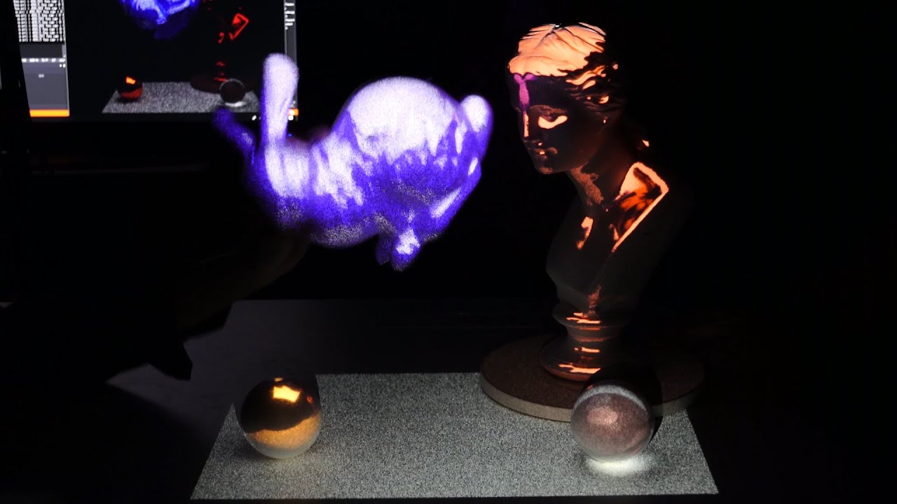 Realistic Dynamic Projection Mapping Using Real-Time Ray Tracing