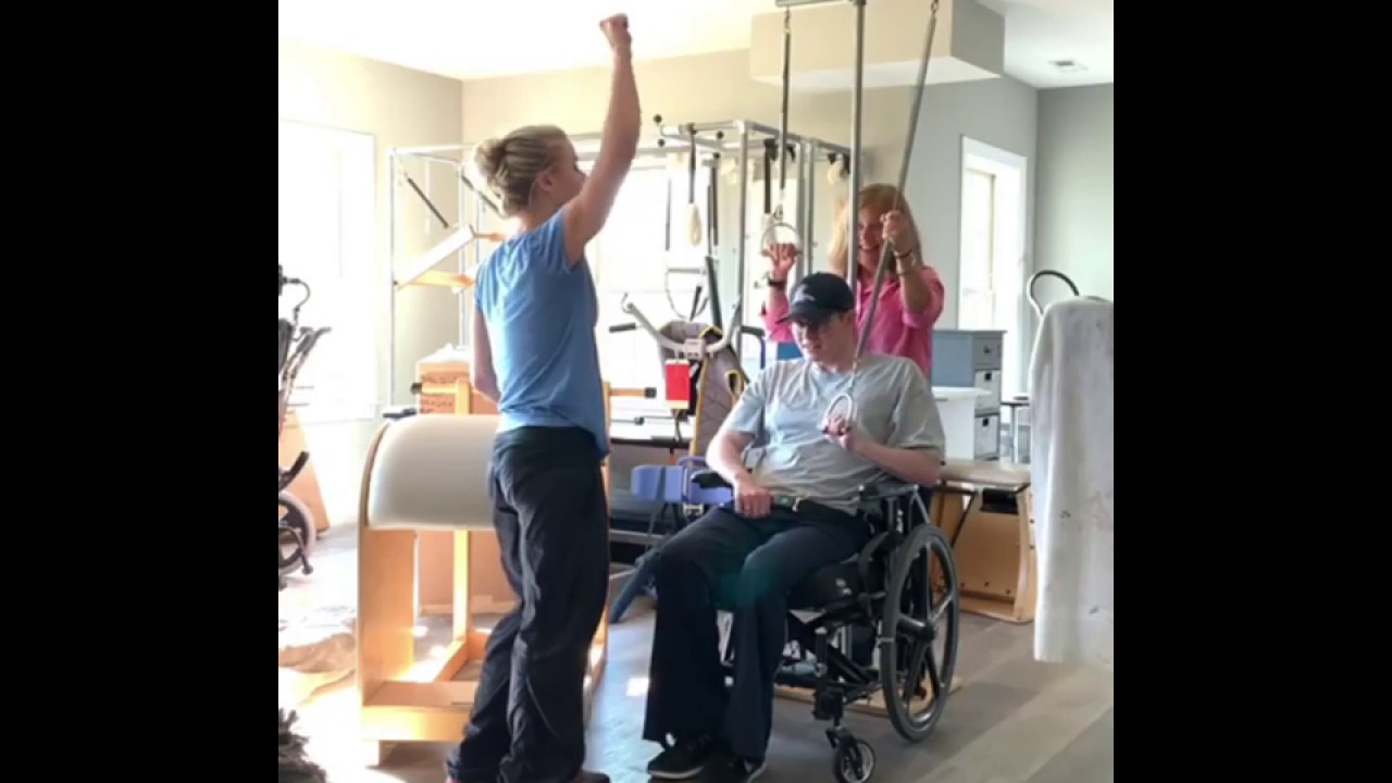 Laura B. Grant using Gratz equipment to help her husband, Jon, with his Rehabilitation