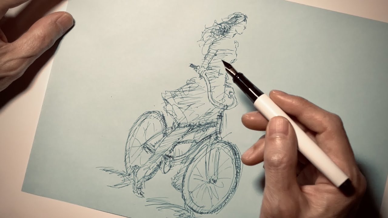 万年筆と水筆ペンで自転車に乗る女性をスケッチ