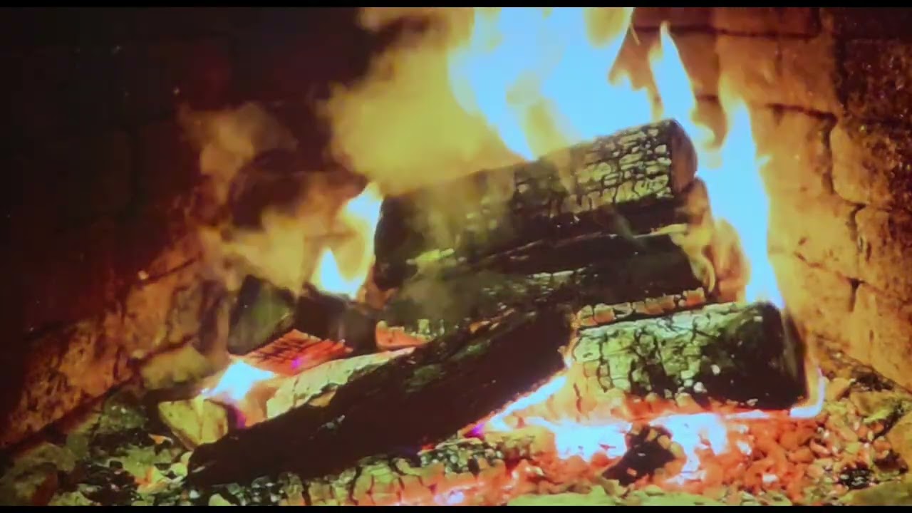 A cozy, roaring fireplace. The crackling of logs and the calming glow of the fire.
