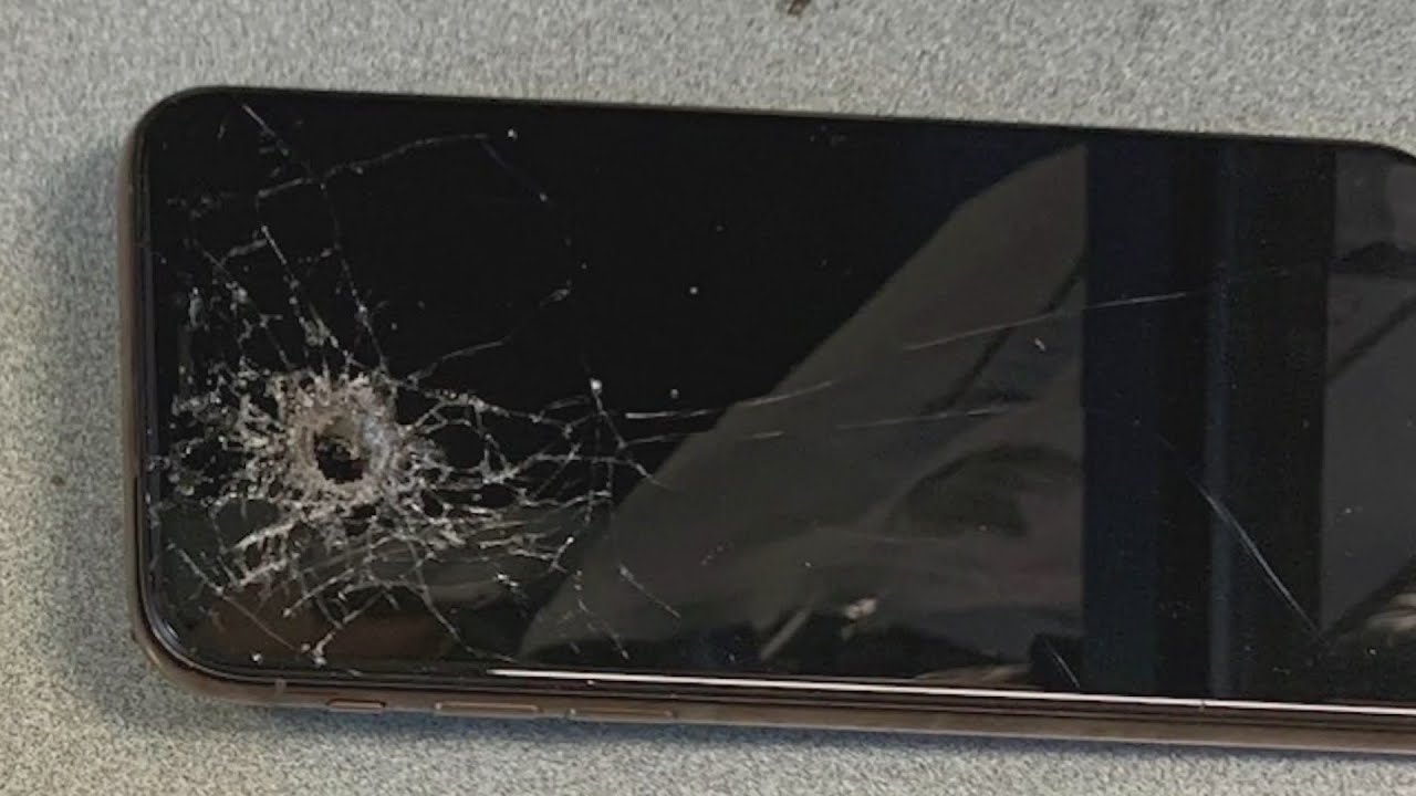 Selfie fail? Woman shoots through phone, neighbor's wall