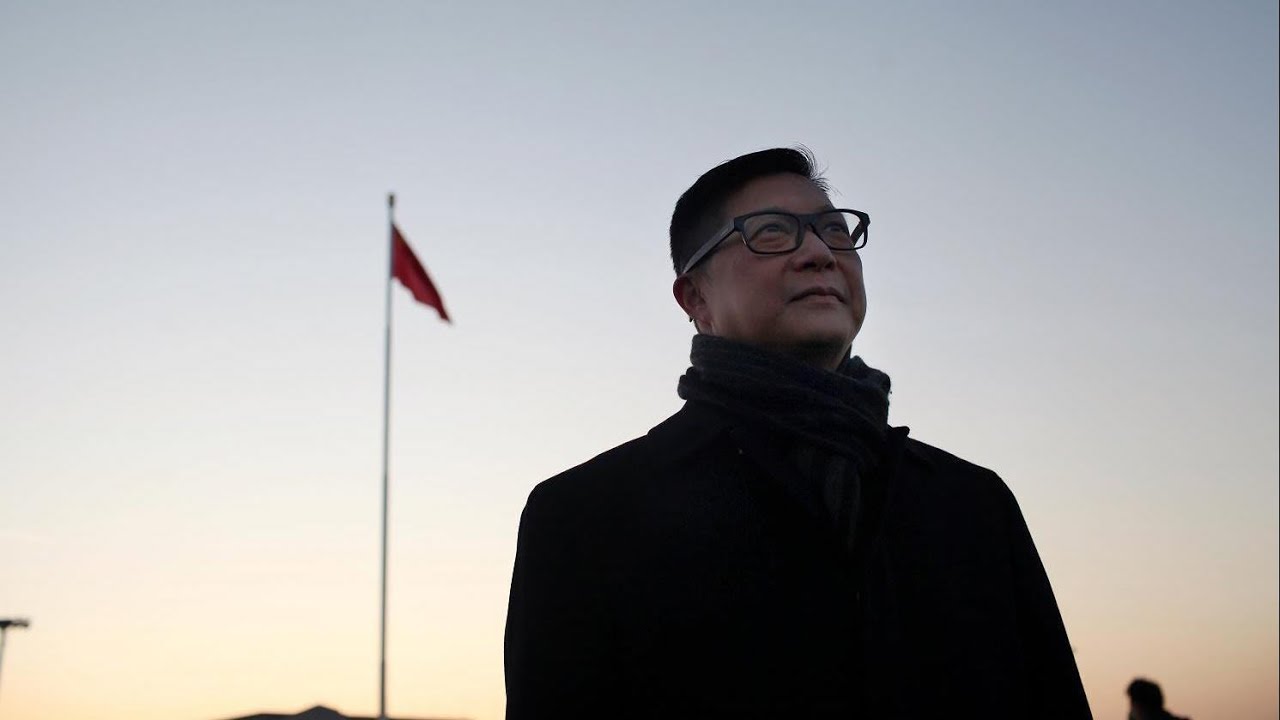 HK police commissioner attends flag-raising ceremony in Beijing