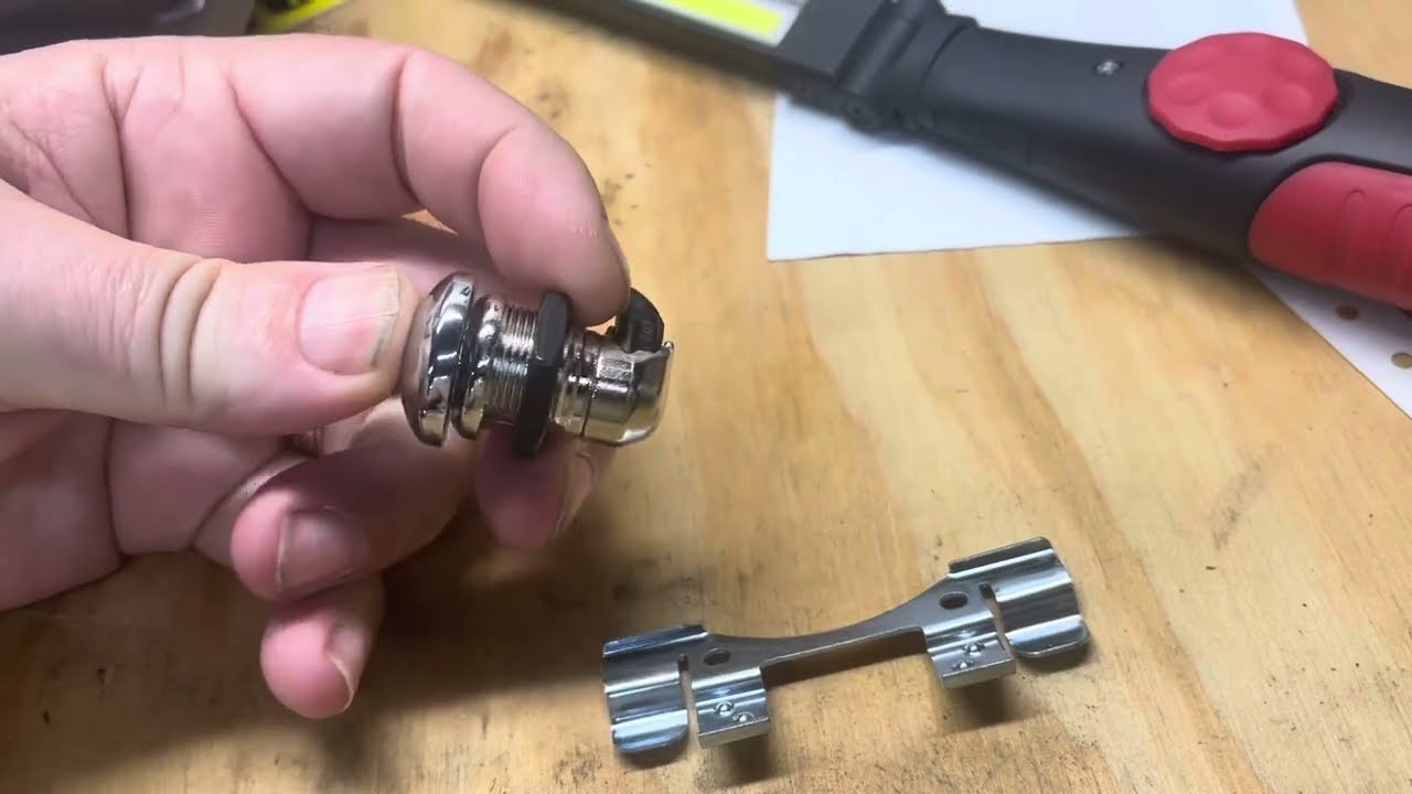 Harley push button fuel door lock