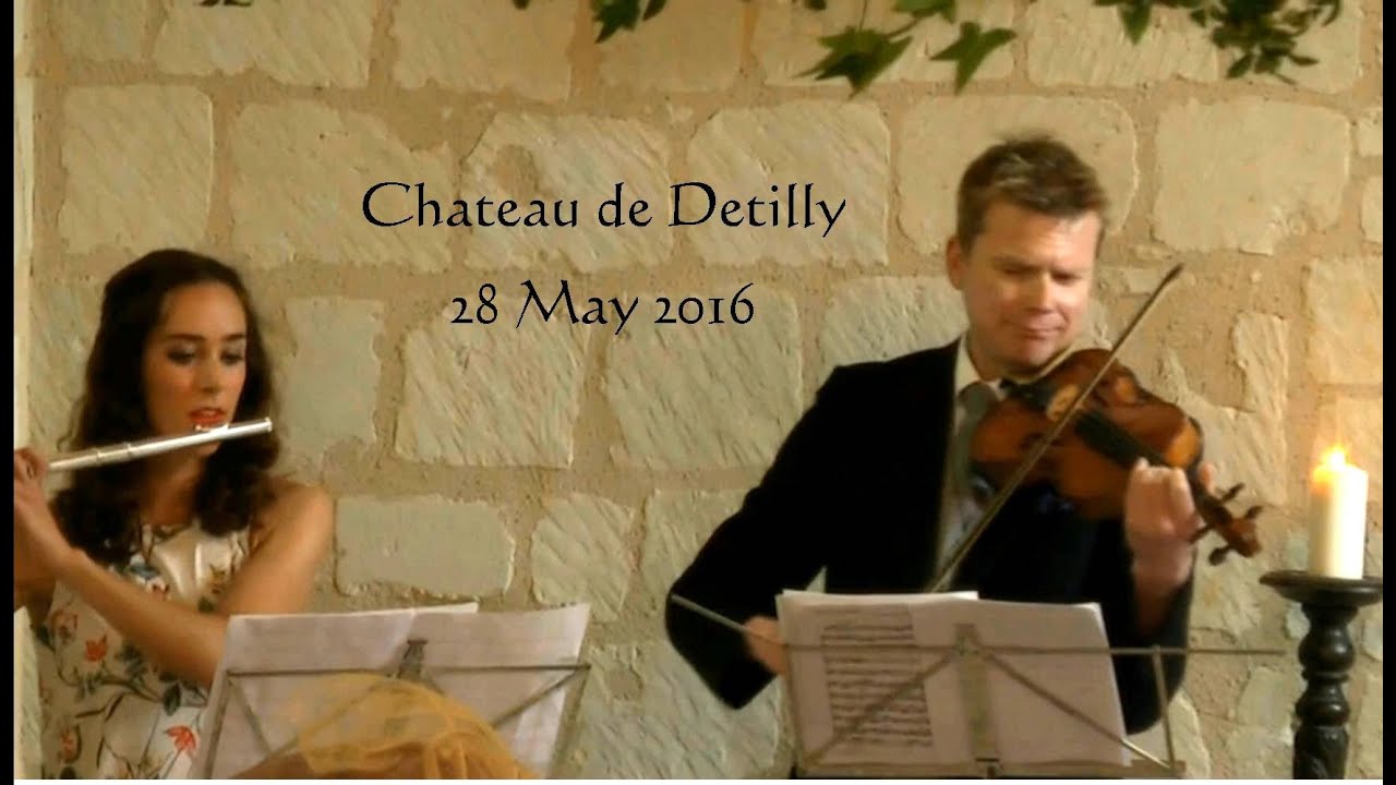 Flute and violin play Pachelbel's Canon for bride's entry.