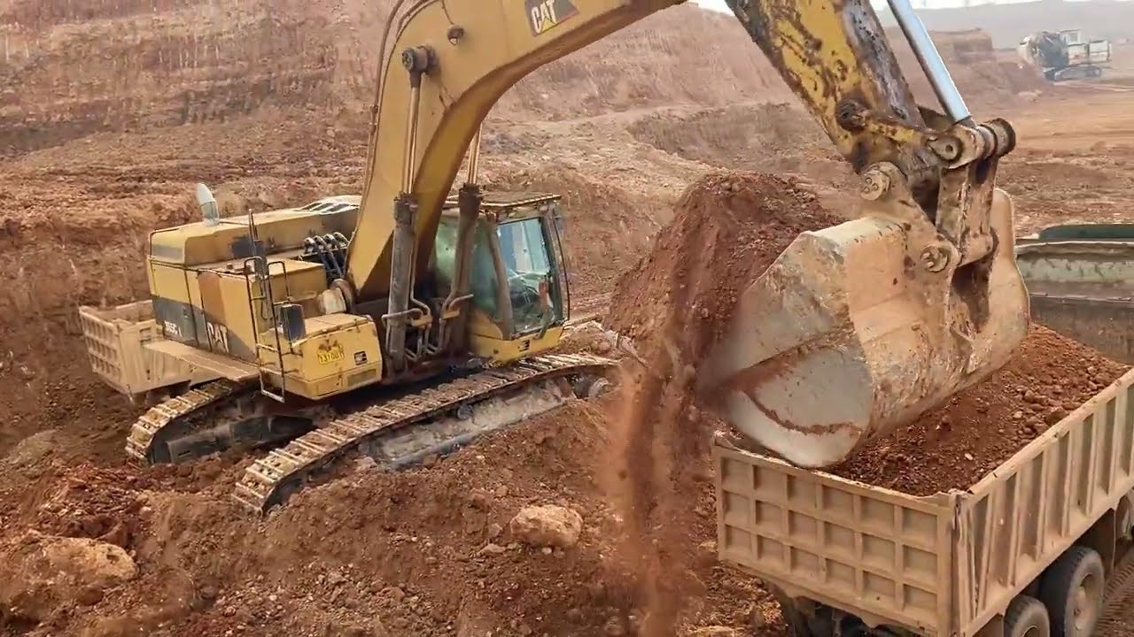 Caterpillar D8H Bulldozer Helping The Caterpillar 365C Excavator
