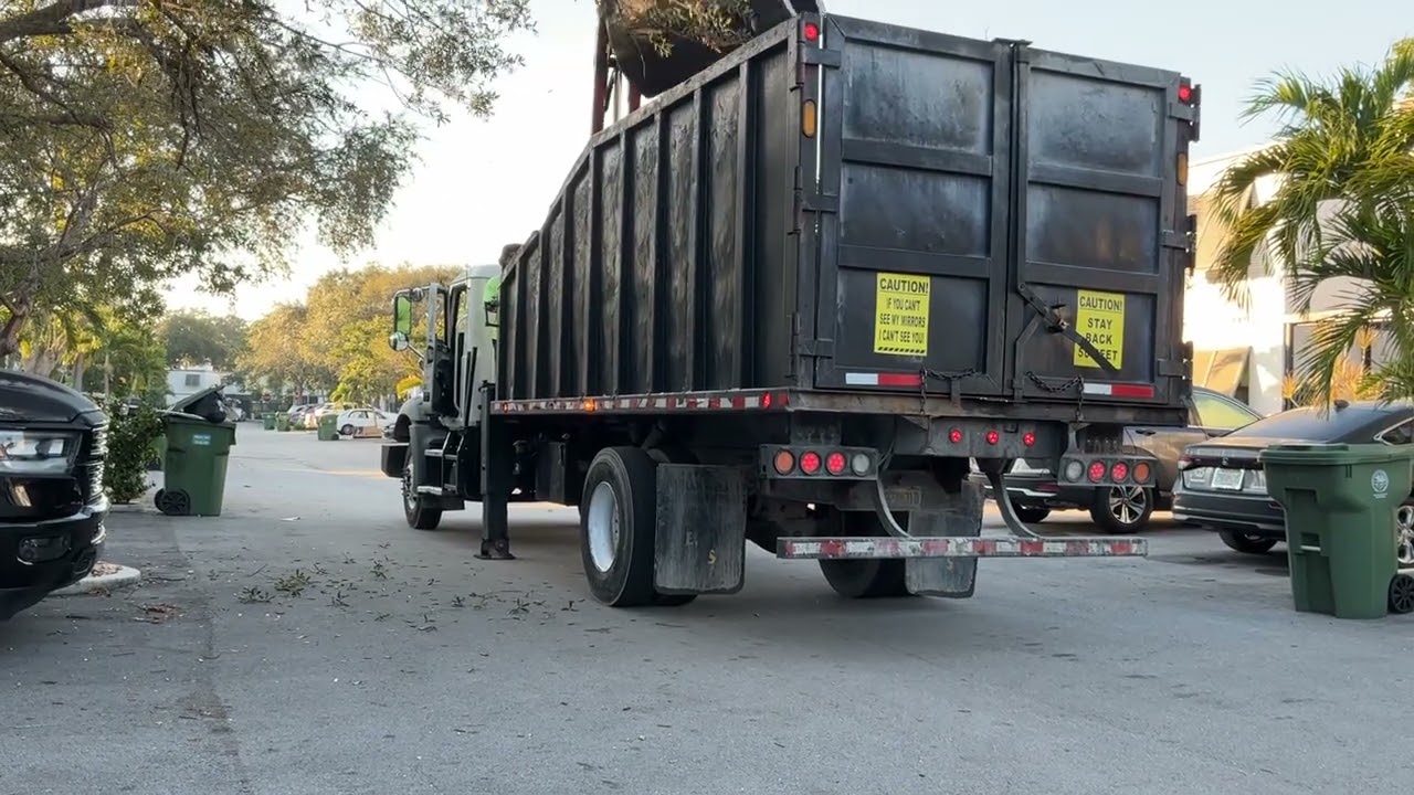 A  eastern waste grapple truck 635 on early bulk collection 