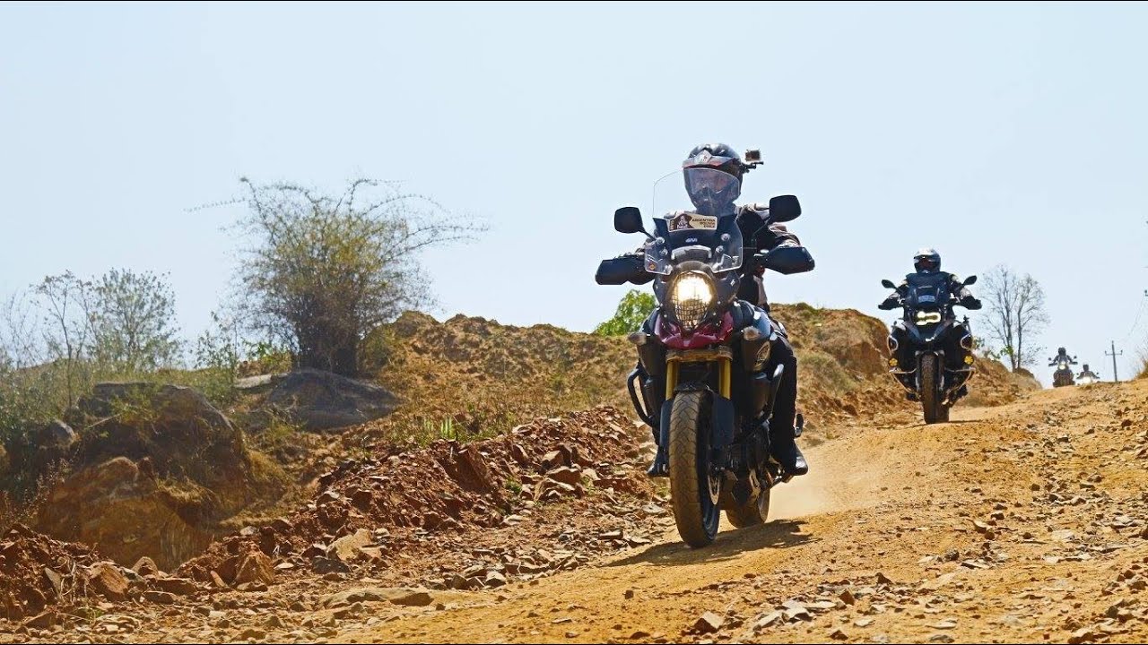 Off-roading on 2014 Red Suzuki V-strom 1000 and 2017 BMW GS 1200 Adventure Olive Green.
