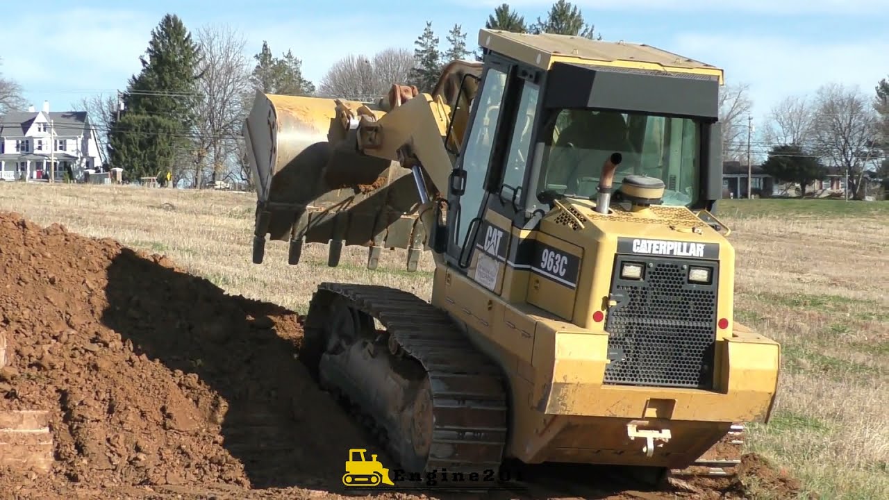 Caterpillar 963 Trackloader Working on a Basement