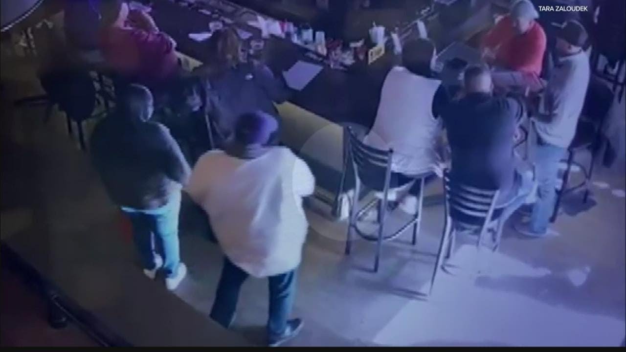 Basketball fan's purse theft captured on surveillance video