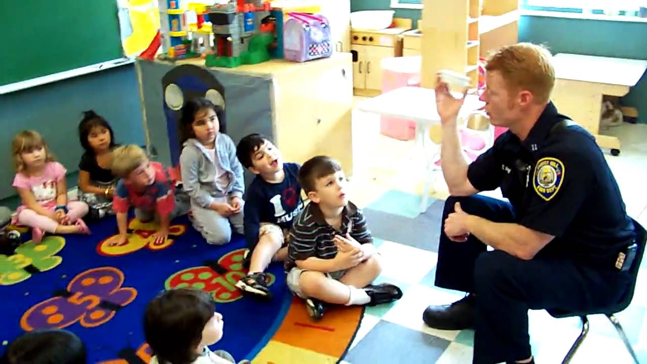 Fireman explains fire stafety and fire alarm to Katz JCC Children