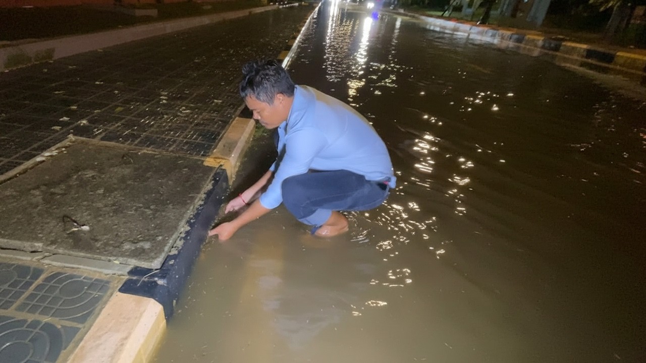Unclogged Culvert Clogged Drain On Street At Night