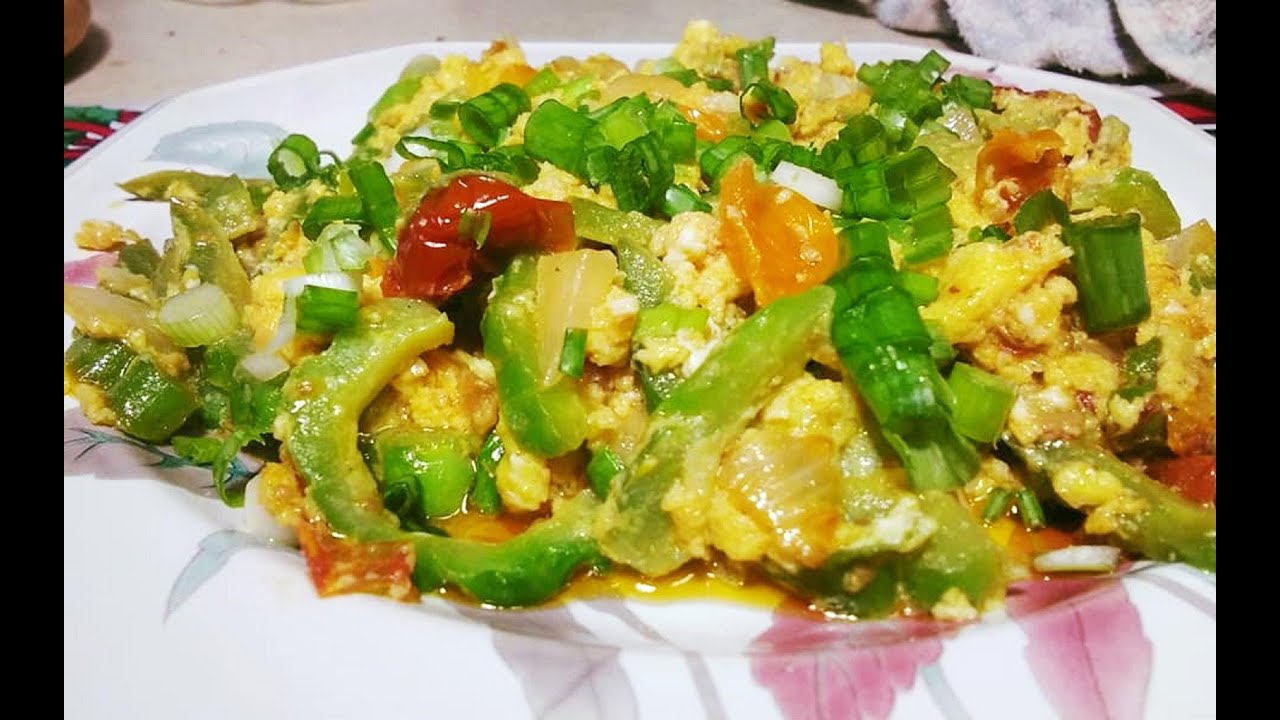 Sauteed Bitter gourd with eggs and tomato./ Ginisang Ampalaya with Egg./ Filipino recipe.