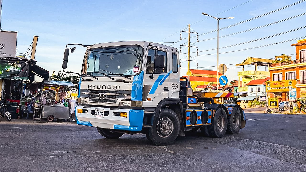 Can These Massive Trucks Navigate This Narrow Winding Road?