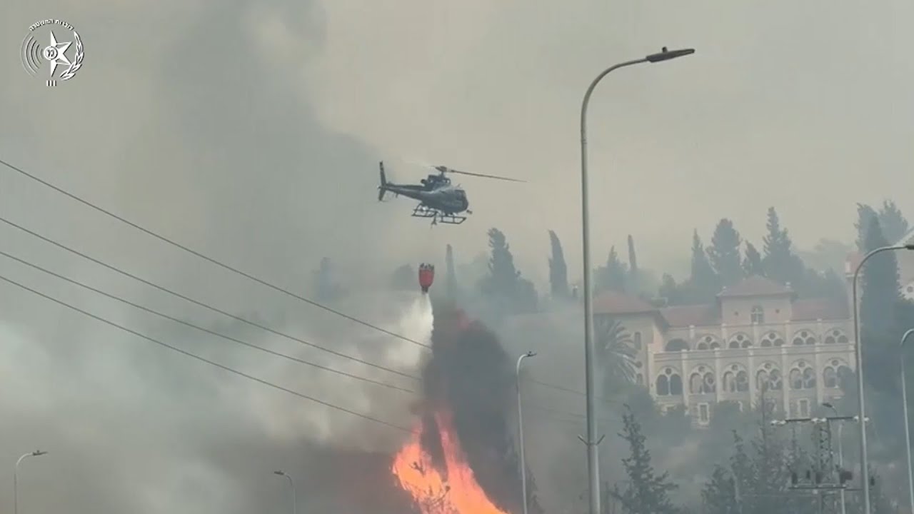 High alert in Jerusalem as Israeli authorities battle huge wildfires with helicopters