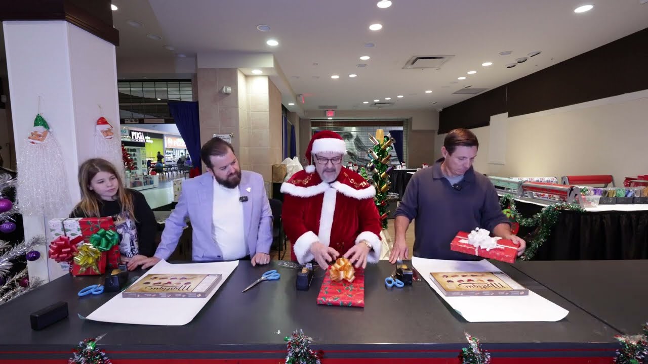 Mayor Patrick Brown & Councillor Dennis Keenan battle for Gift Wrap Bragging Rights!