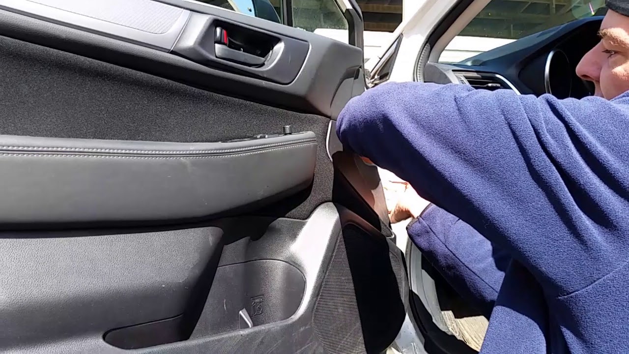How to remove the door panel on a Subaru Outback