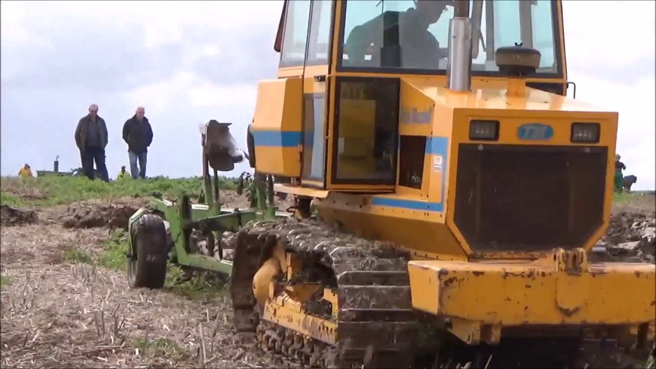 TRACTORS, CRAWLERS AND PLOWS