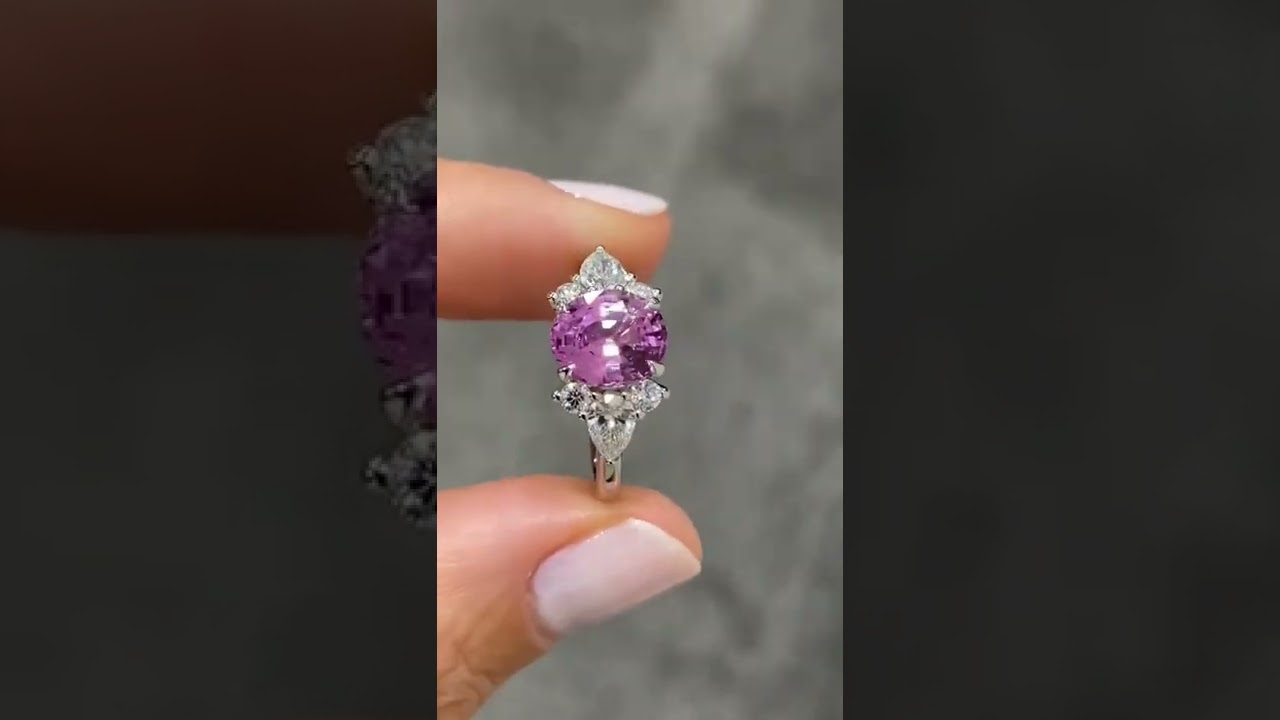 Bespoke Engagement Ring. Pink Sapphire Round cut Centre with three diamond on either side stones.
