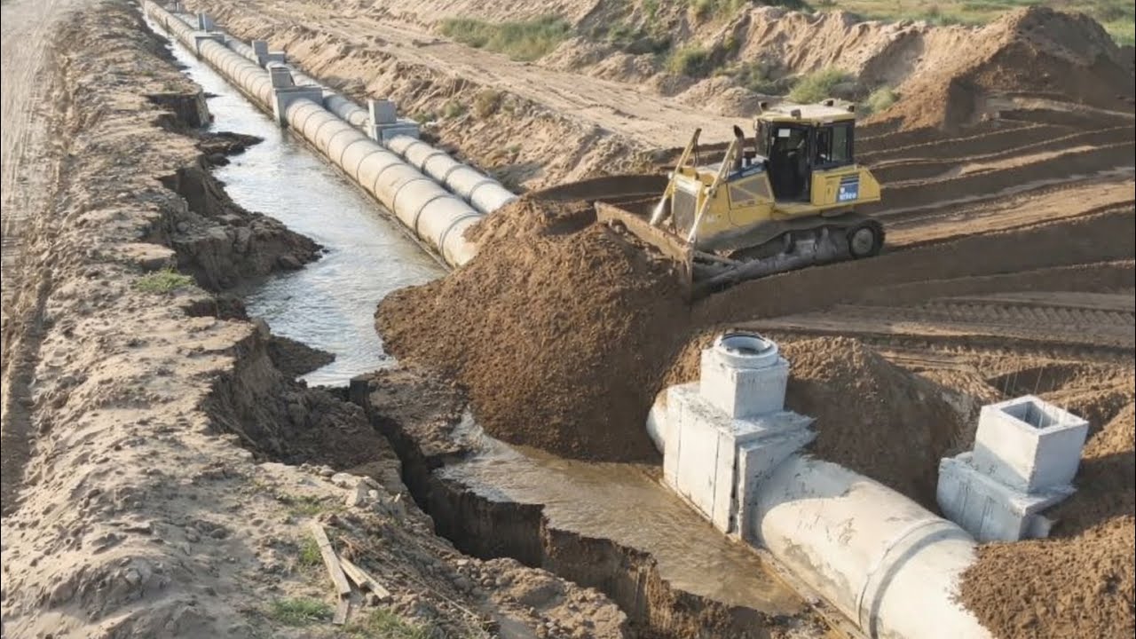 Strong Komatsu Dozer Clearing Sand Fill Coverage The Drains And Crack On The Land