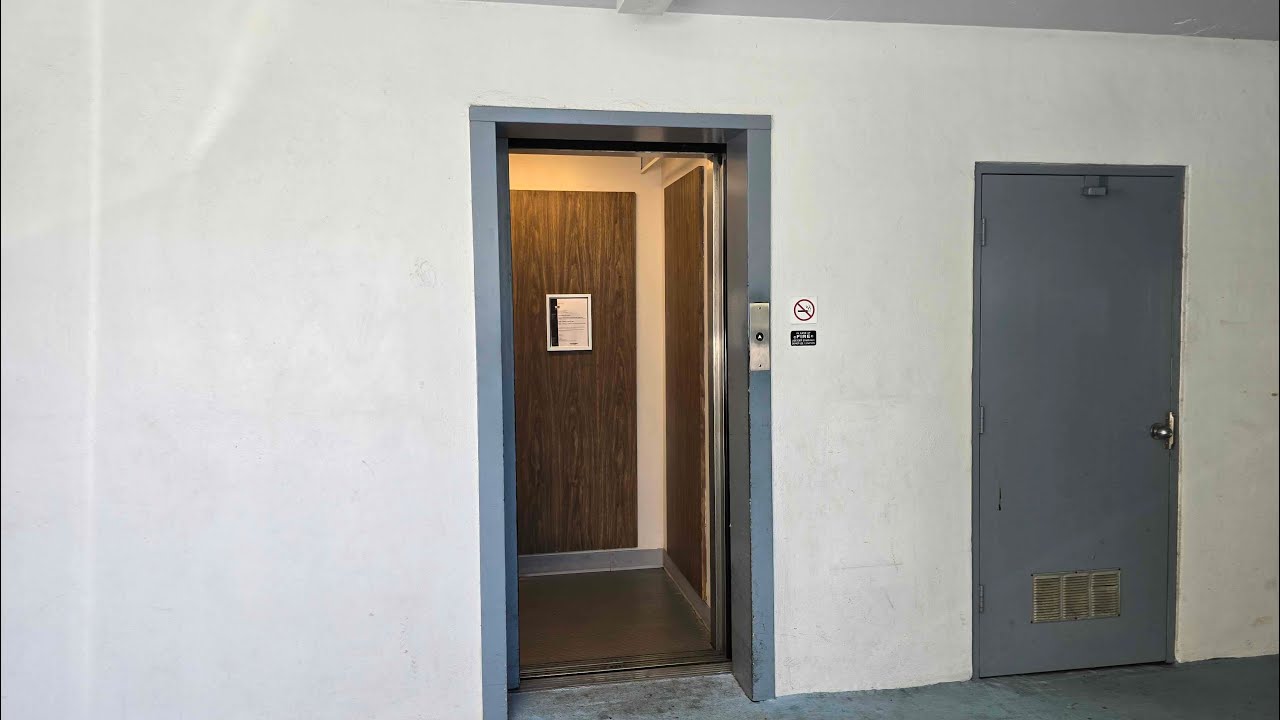 Honolulu, HI: Vintage OTIS Lexan Hydraulic Elevator in an Apartment Building