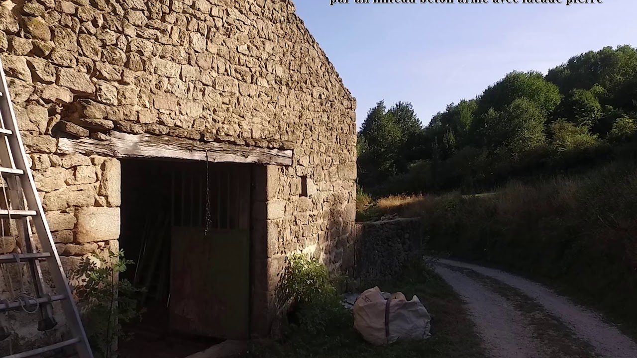 Remplacement d'un linteau bois par un linteau b&eacute;ton arm&eacute; avec fa&ccedil;ade pierre