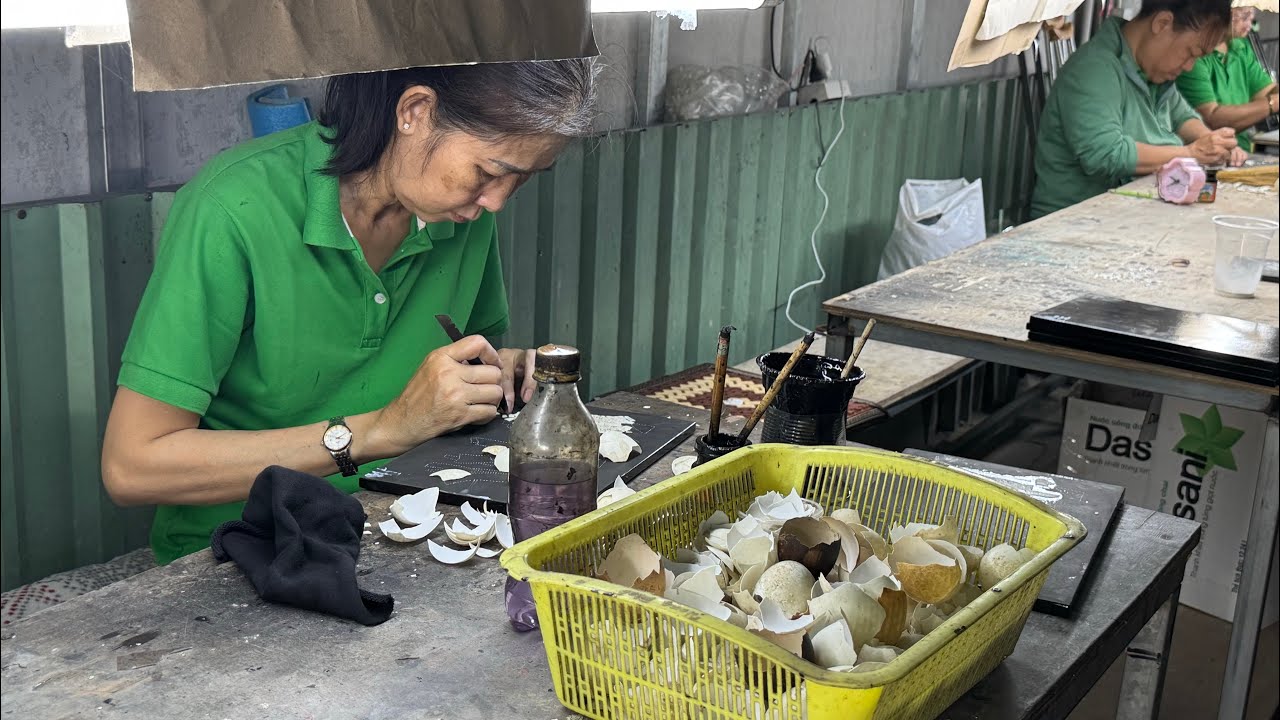 Creating artwork with eggshells and seashells at Lamphat Center for People with Handicap near Saigon