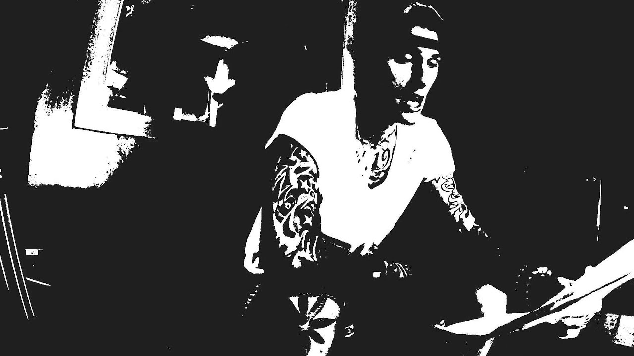 Machine Gun Kelly rapping on the couch.