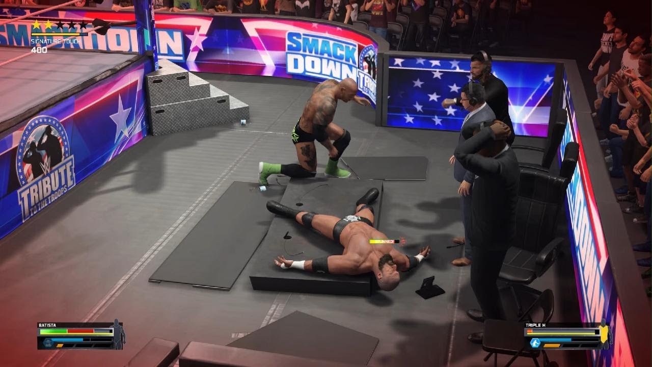 WWE 2K25 Batista and Triple H fight