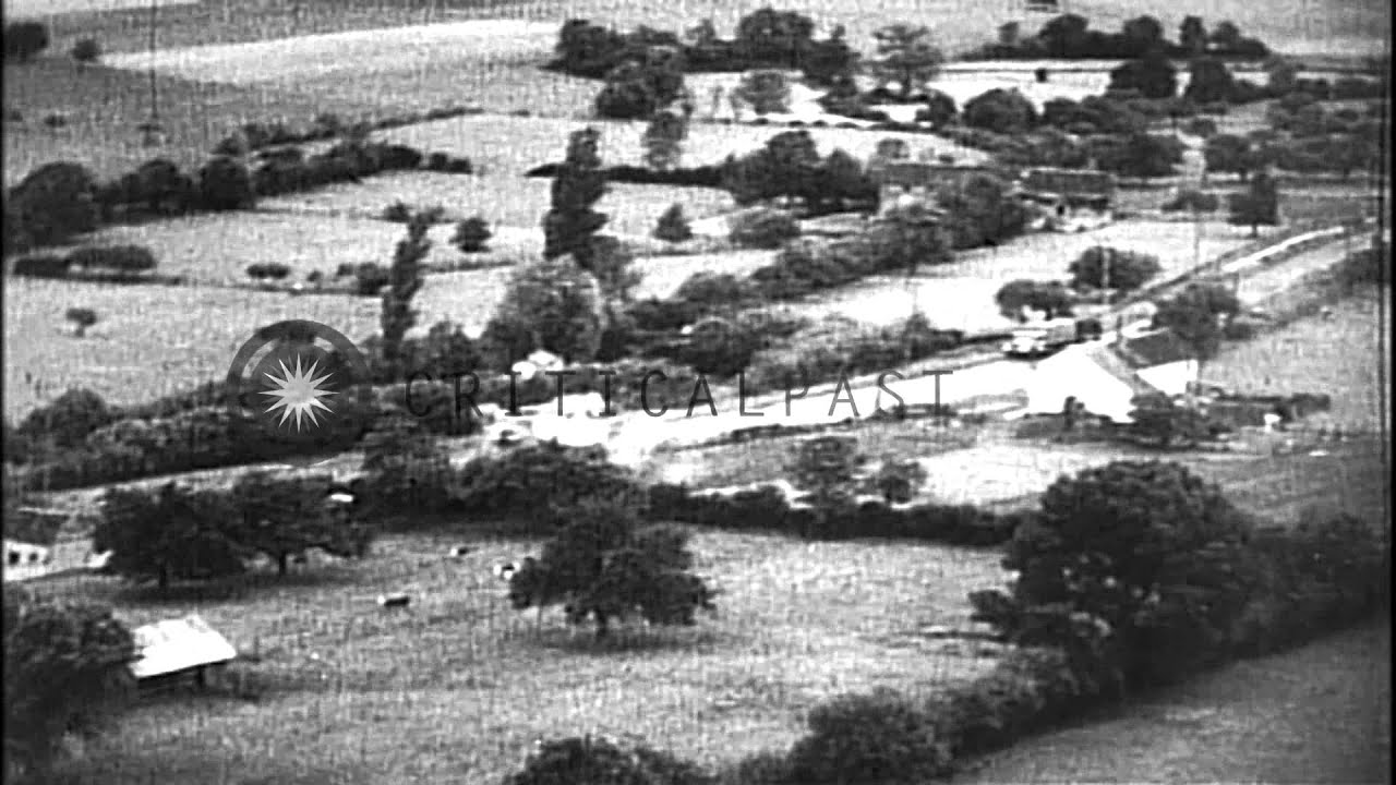 Strafing of trains, railroad yards, tug boats and barges in canals by USAAF fight...HD Stock Footage