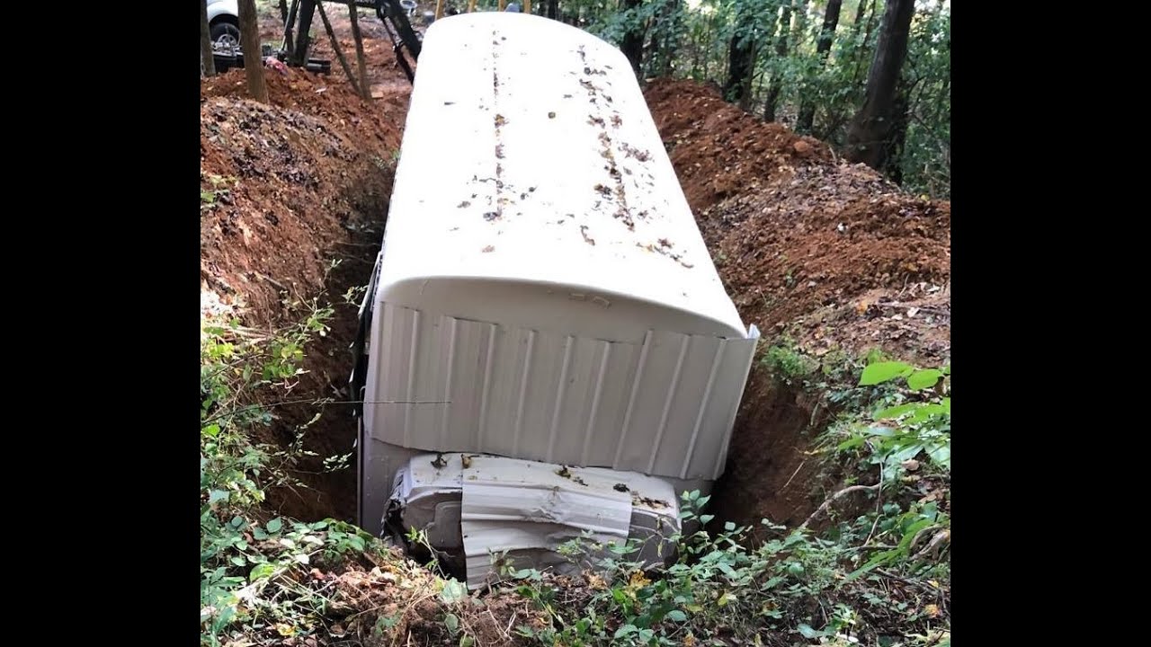 School bus underground survival bunker Part 5. Placing the Bus in the hole