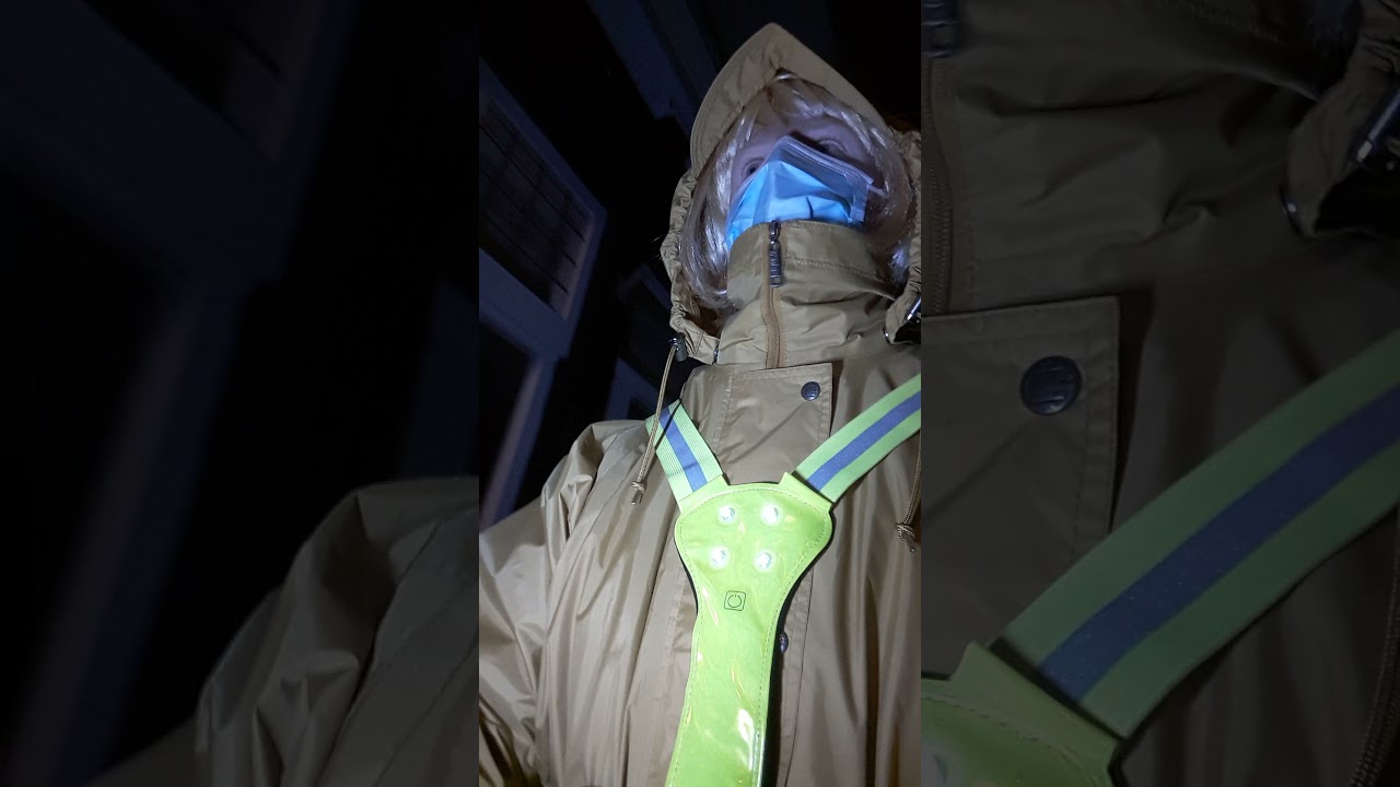 walking in the dark with a yellow raincoat