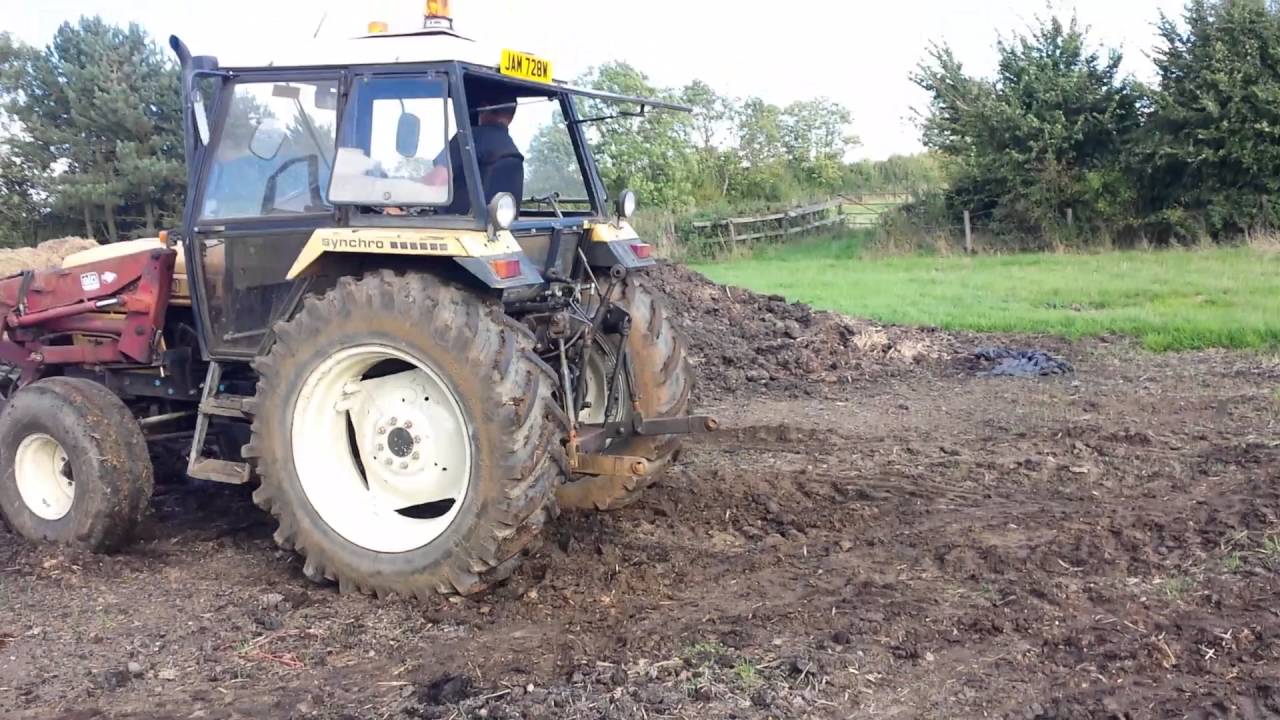 Leyland 802 loading muck with fork and grab