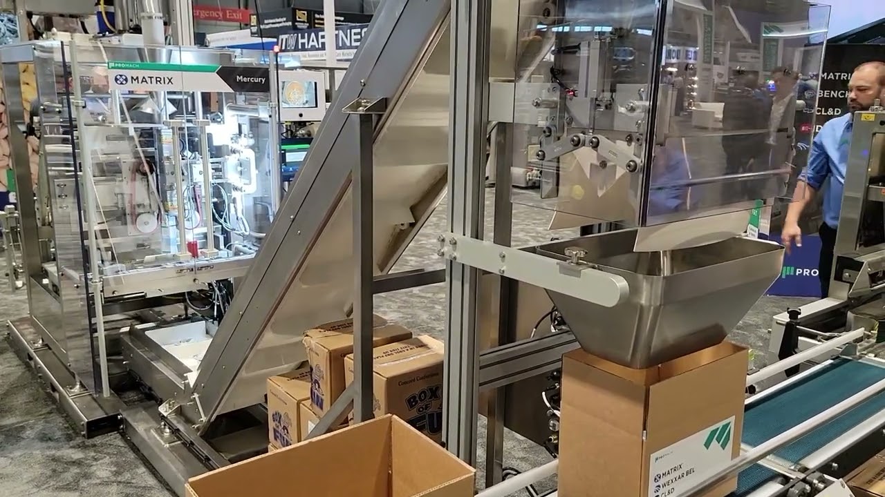 Mini Packaging Line with Intermittent bagger, cup-filler, conveyors, counting systems, and boxing.