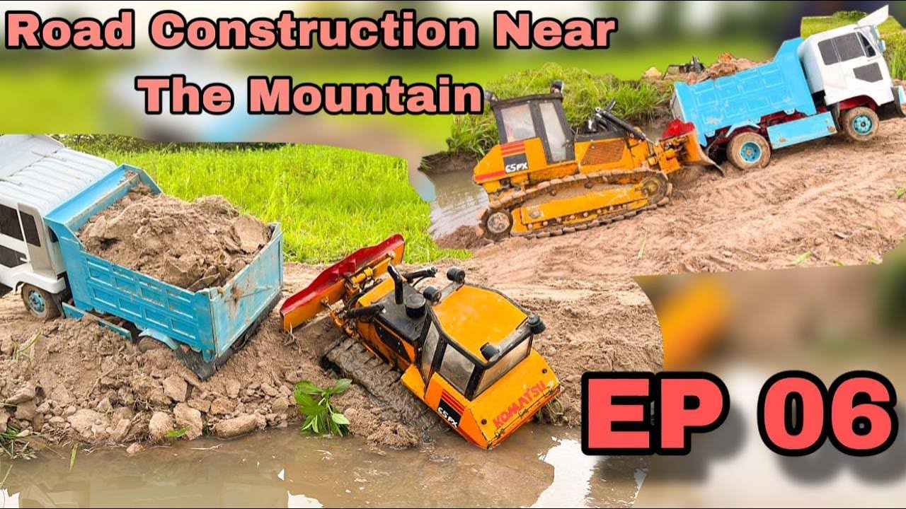The contractor has formed the road near the mountain next to the river. EP 06 #excavotor #truck #car