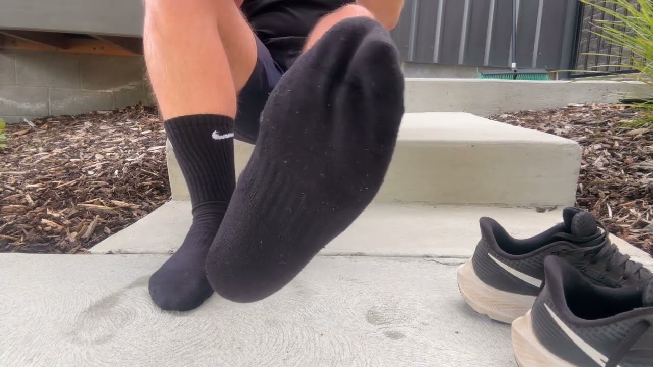 Sweaty black NIKE socks after workout