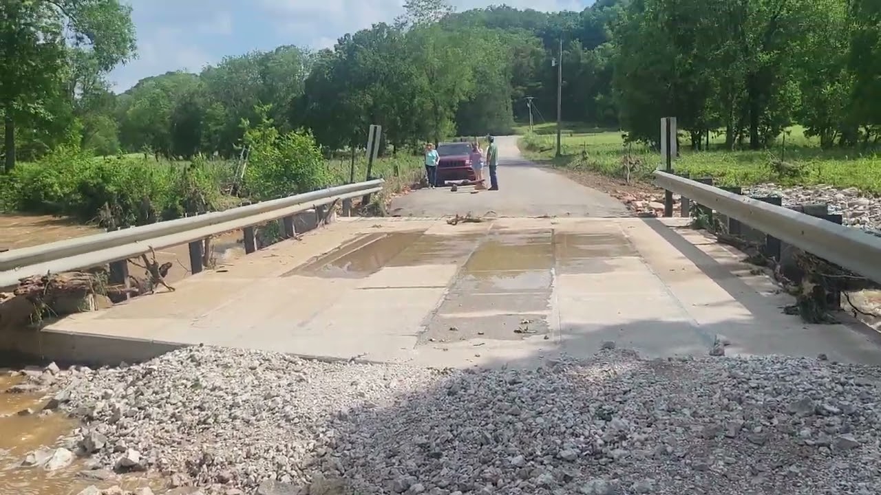 Flooding and wash out on brand new bridge from storm