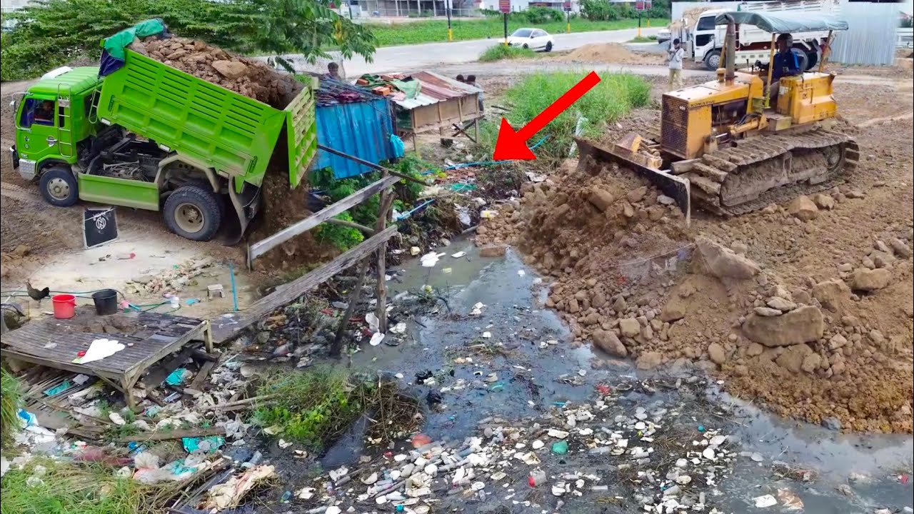 Best Landfills Operation! KOMATSU D31P bulldozer Loading soil reclaims Dirt Canal with 5Ton Trucks