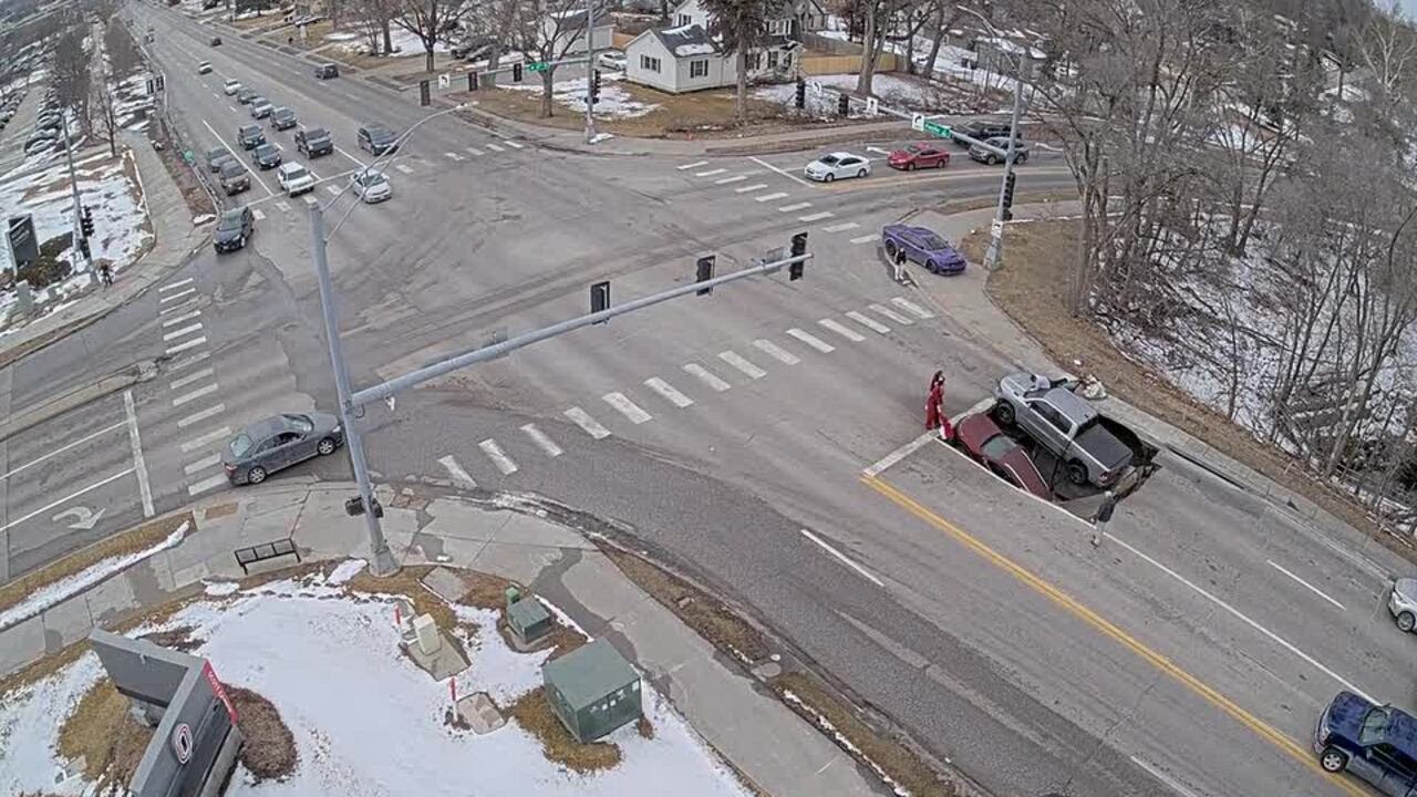 UNO security camera captures video of vehicals falling into sinkhole