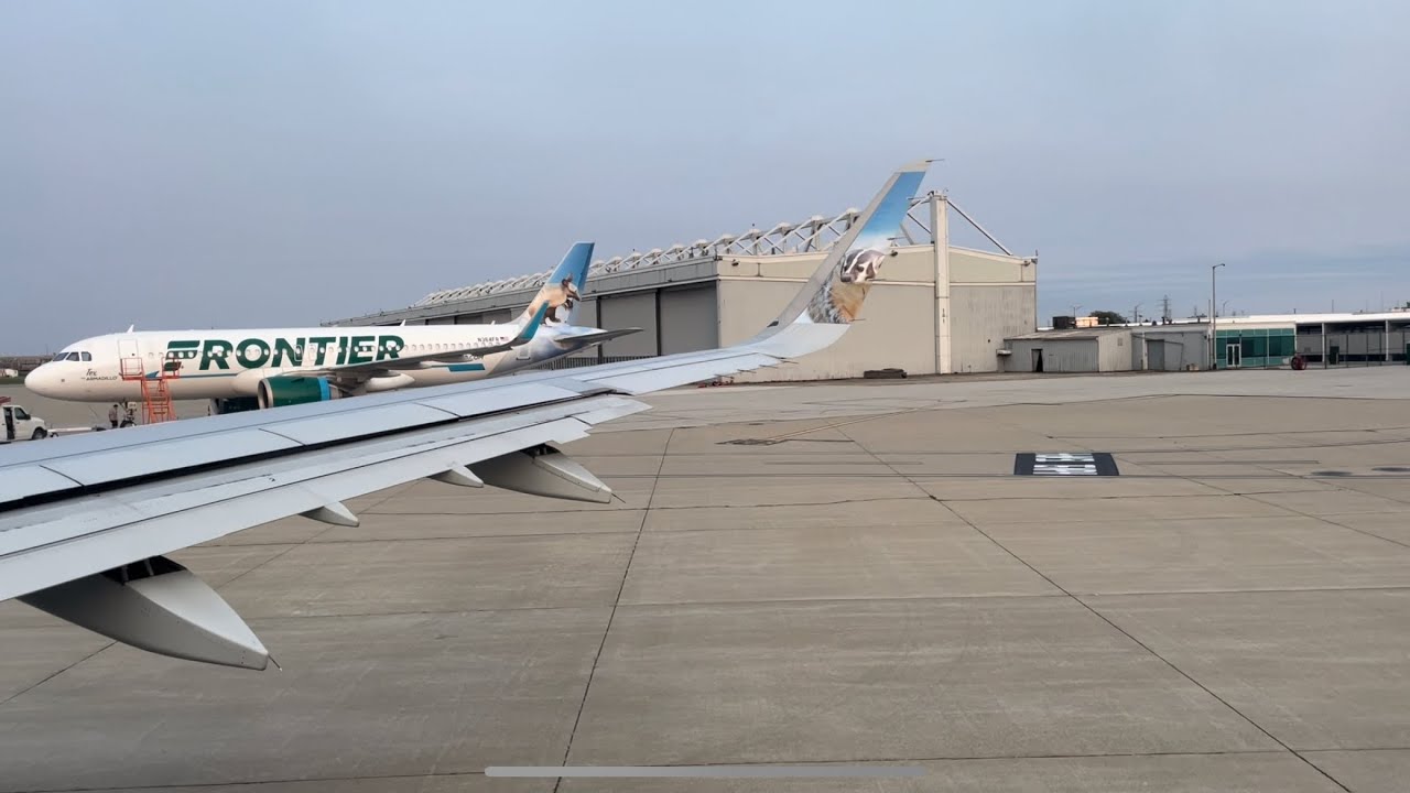 Frontier Airlines A321 boarding, pushback, and sunset departure from Cleveland ( CLE )