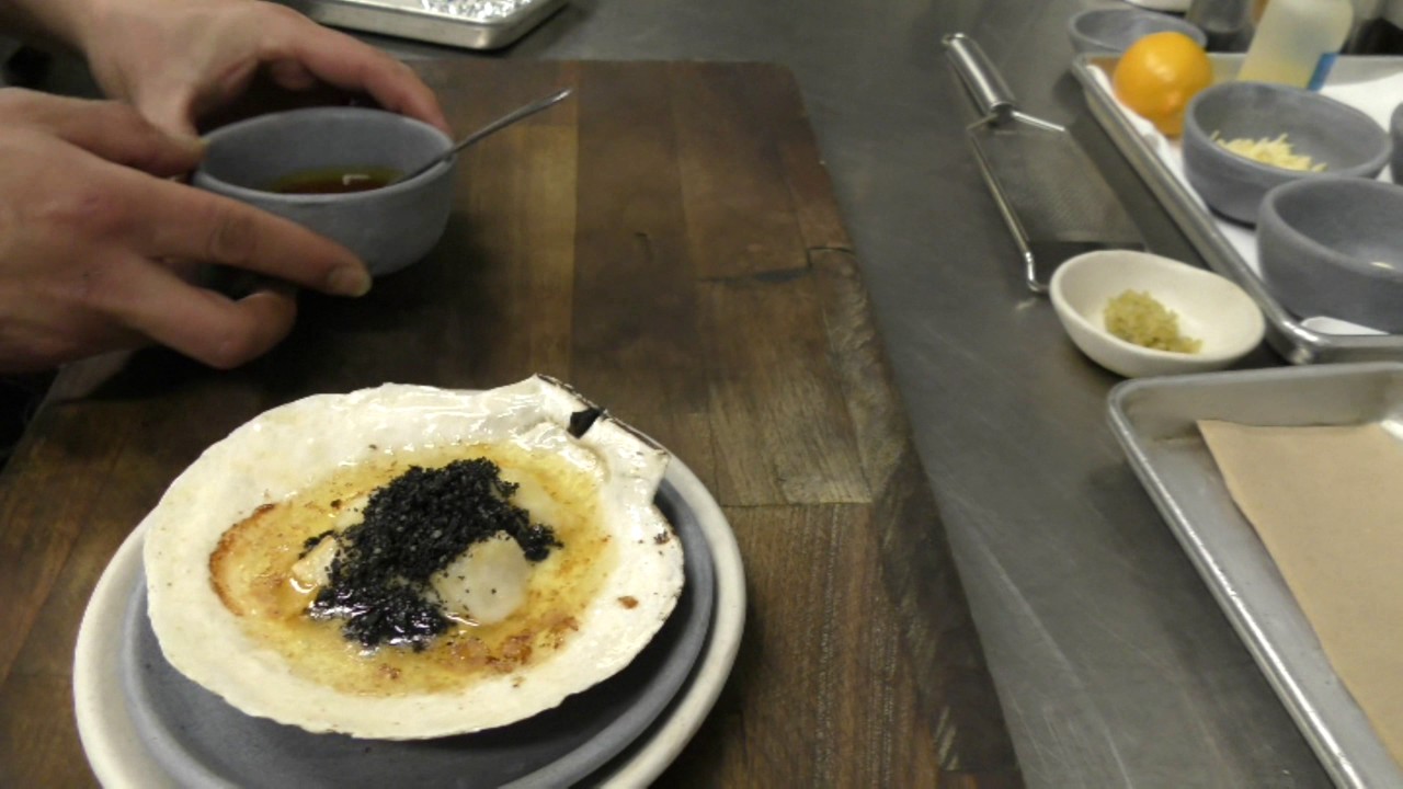 Chef Patron Carlos Salgado at Taco Maria prepares a signature dish