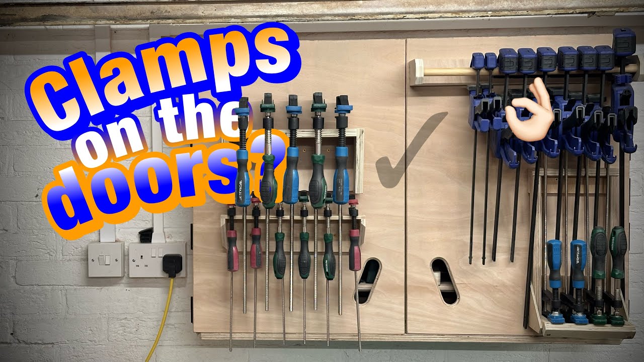 Clamp storage on the front doors of a wall cabinet