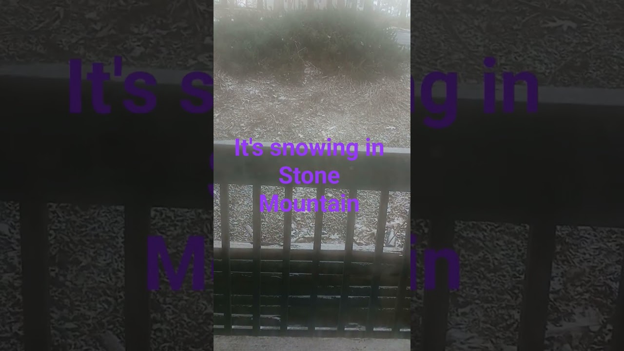 it's snowing in Stone Mountain, GA