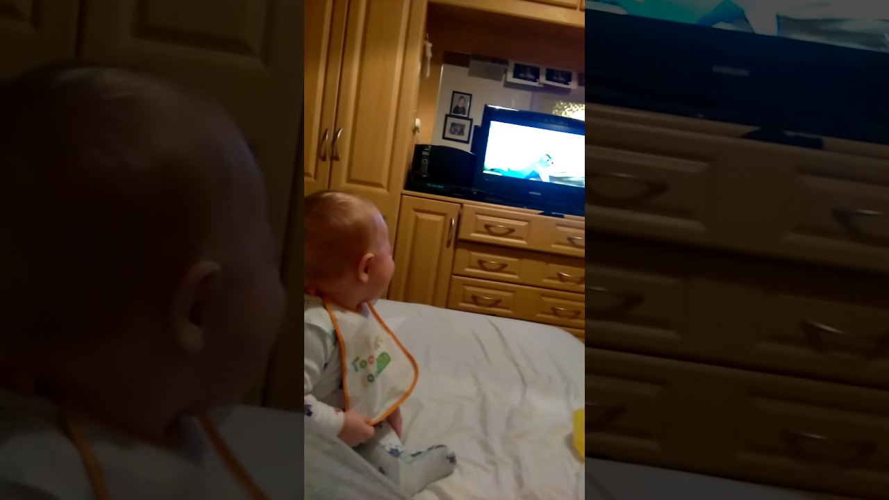 Baby laughing hysterically at the tv this video will make your day